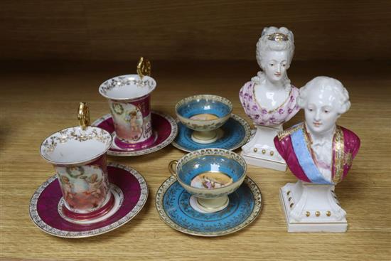 A pair of German porcelain busts of Louis XVI and Marie Antoinette, tallest 16cm, and four cups and saucers